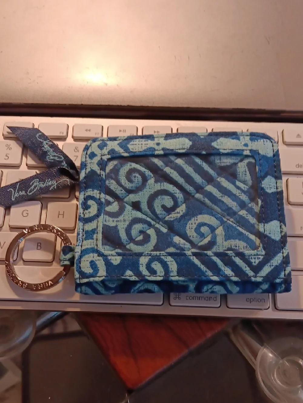 Vera Bradley Zip ID Case in a blue batik-inspired geometric pattern. - Picture 2 of 11